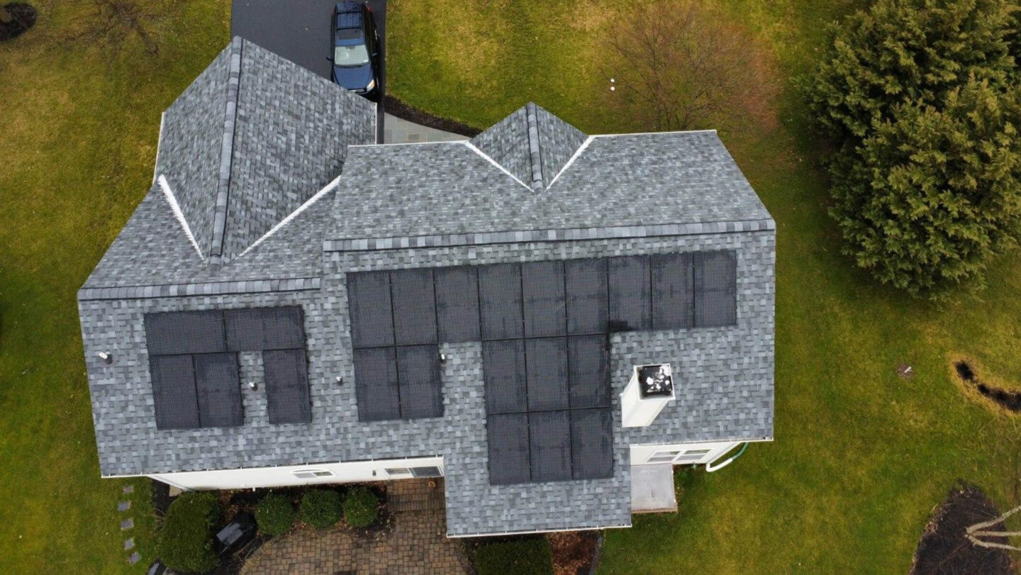 Residential solar panels installed on the roof of a home, making renewable energy more accessible and affordable.