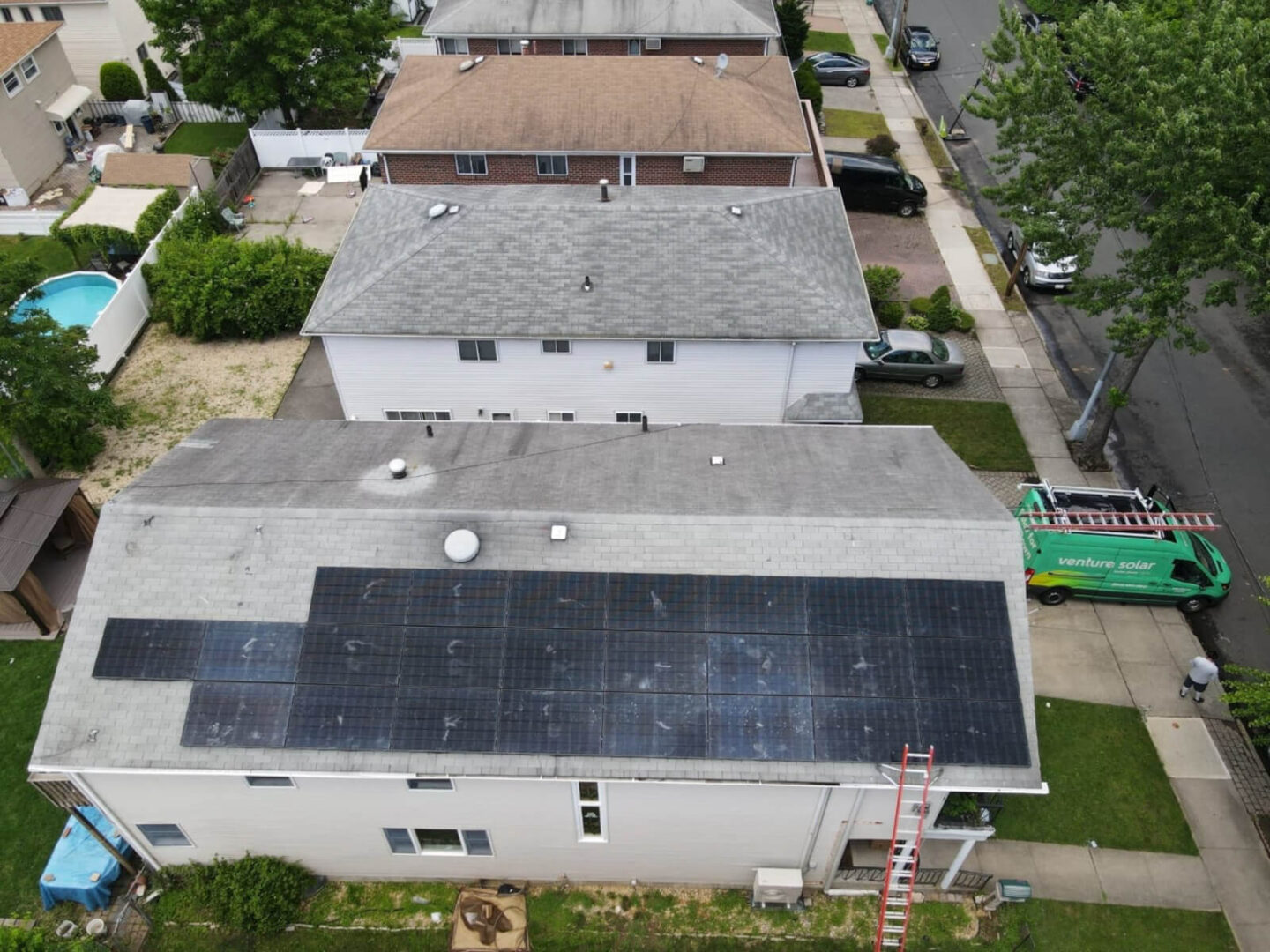 Solar panels on the roof of a house, turning sunlight into a renewable energy source to power the home.