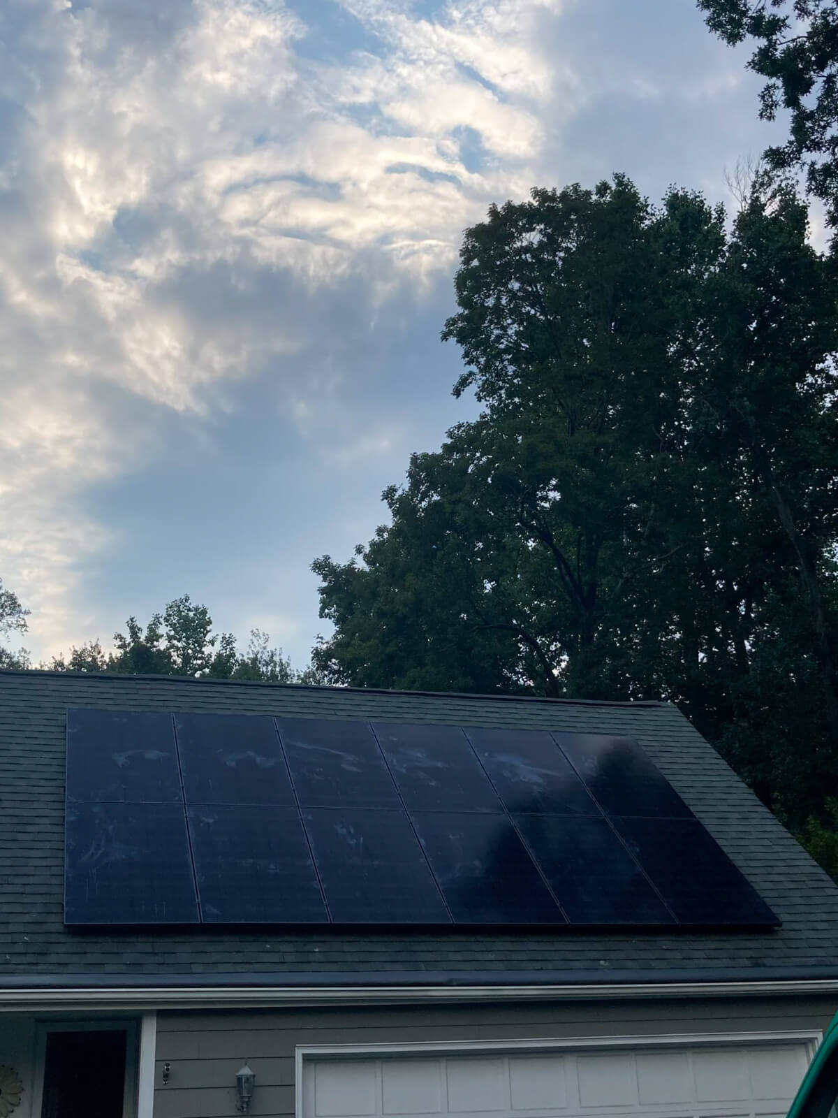 A home with solar panels installed on the roof, maximizing energy efficiency and promoting sustainable living.