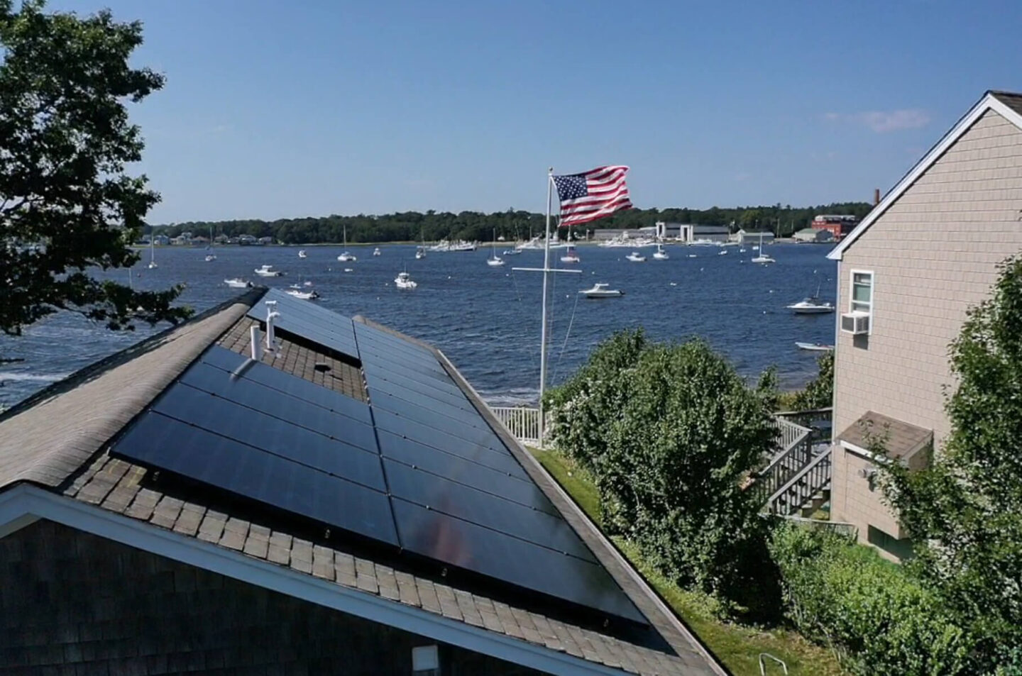 A property by the ocean with solar panels on the roof