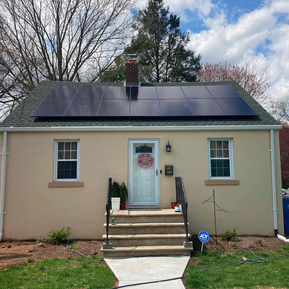 A charming home with solar panels installed by Venture Home’s expert solar installers.