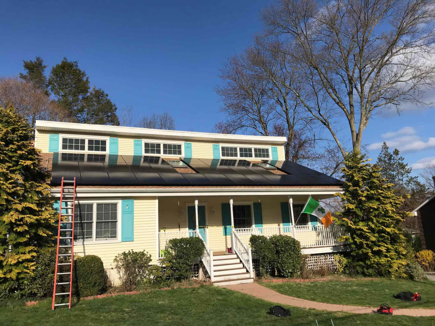 A home with solar panels installed on the rooftop, harnessing clean energy.