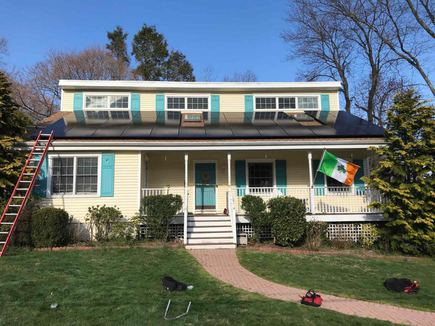 A residential home featuring solar panels installed on the roof.