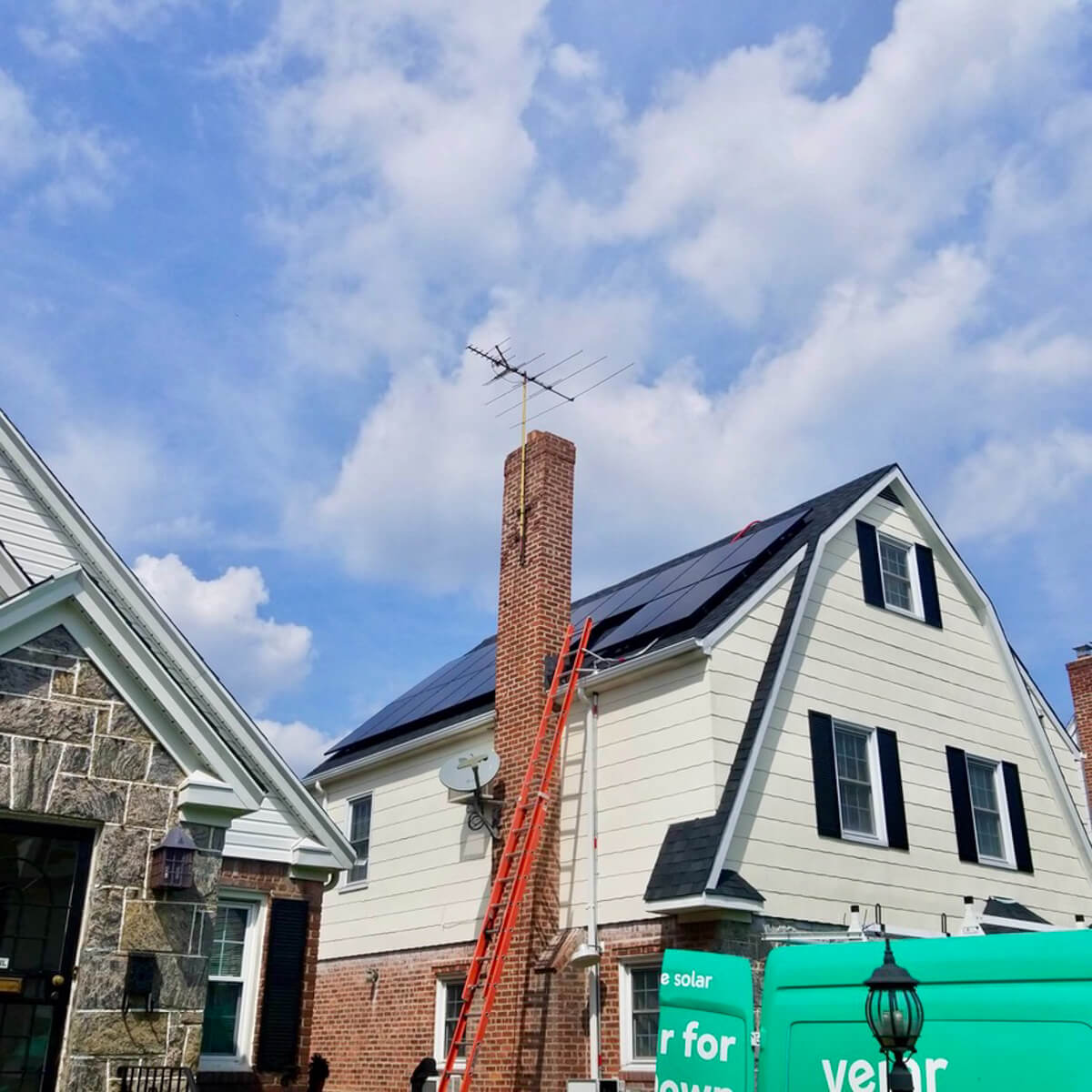 Solar panels installed on the side of the roof of a residential property.