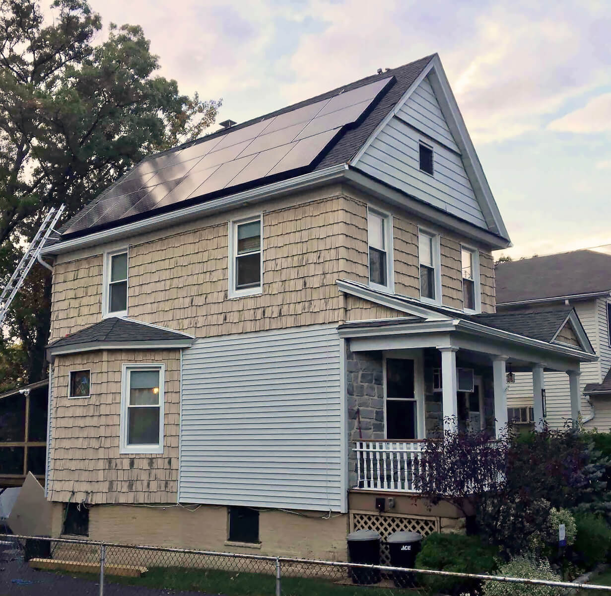 A home with solar panels installed on the roof, capturing the sun's energy for a sustainable future.