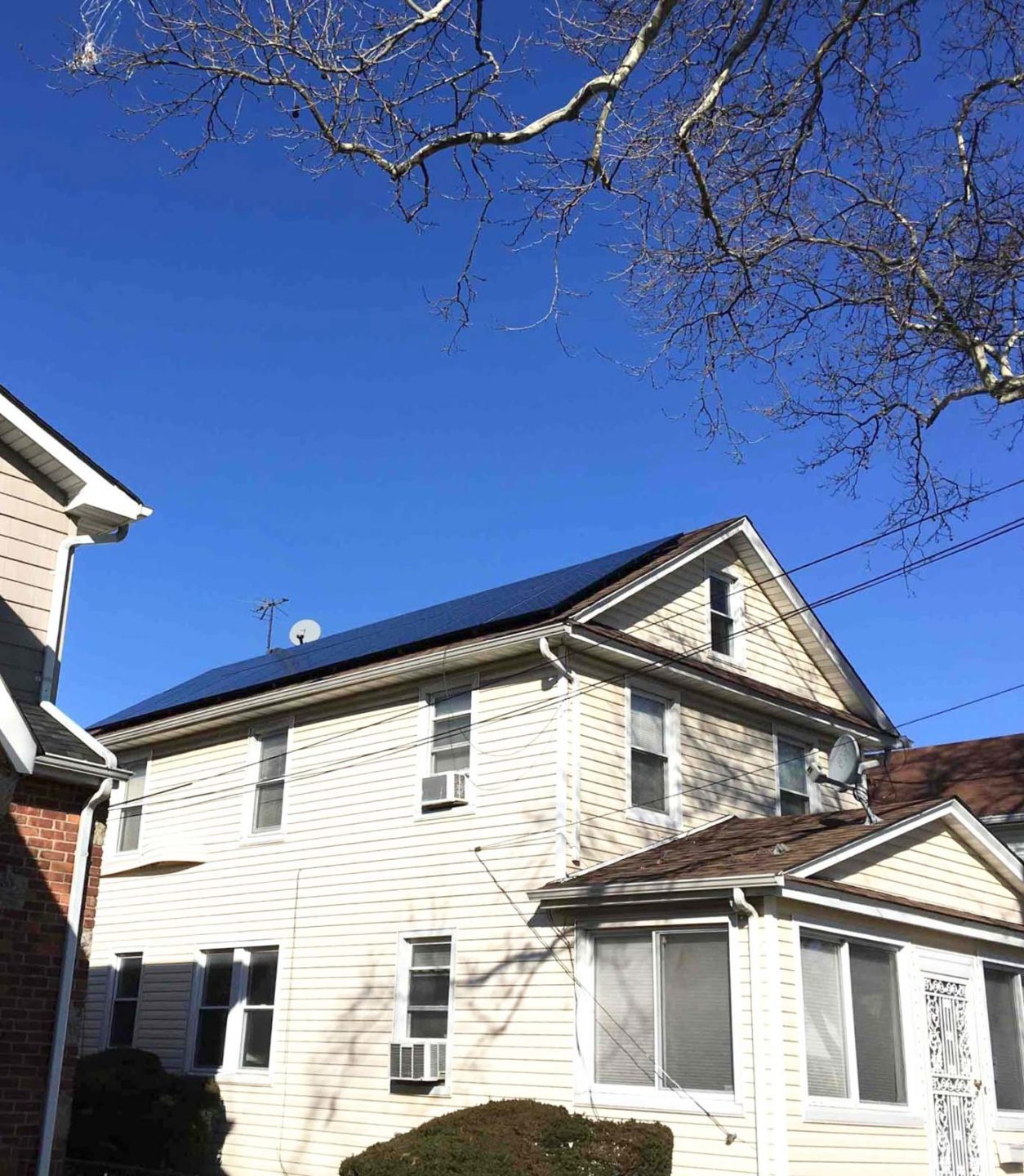 Solar panels on the roof of a home, making the most of natural resources to power the house efficiently.