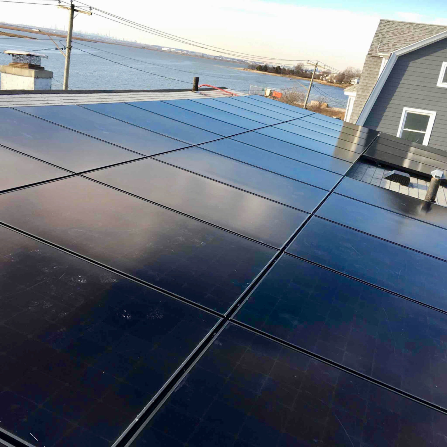 A close-up view of solar panels installed on the roof of a residential property, capturing solar energy.