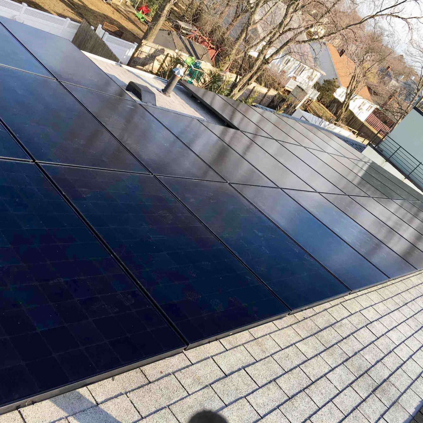 A roof with solar panels on it installed by Venture Home expert installers