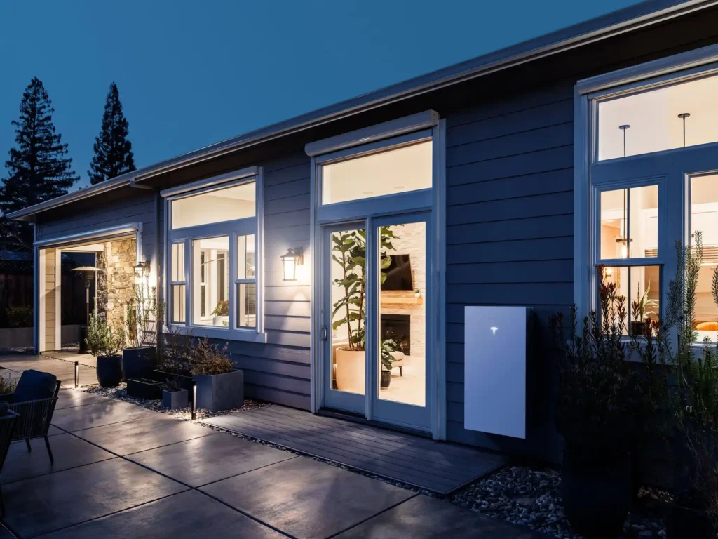 The exterior of a home with bright lights shining, creating a welcoming atmosphere.