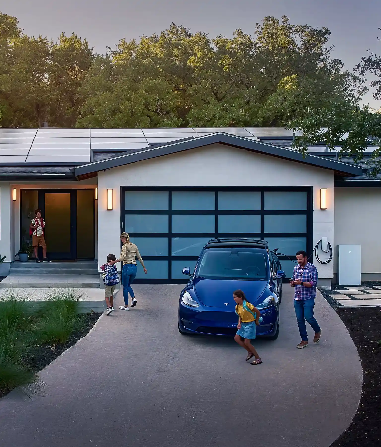 A family in Massachusetts enjoying the benefits of solar power, with solar panels installed on their home.